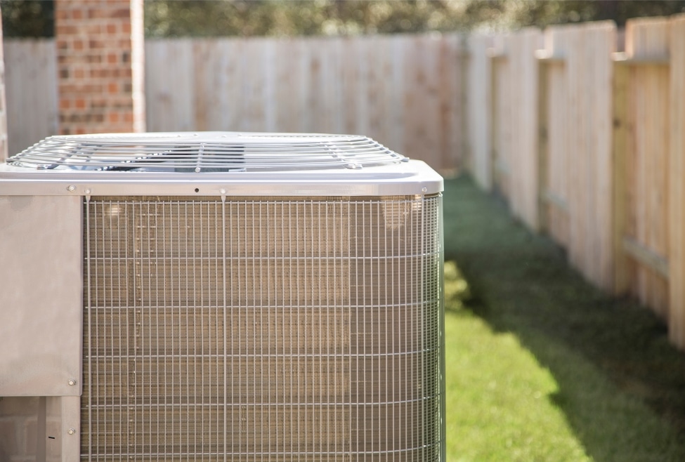 Residential air conditioner unit outside a home, related to clogged AC drain line inside house, HVAC repair, and AC maintenance services by Arctic Air. Call now for help with air conditioner drain line inside house, clogged AC drain line, AC drain line cleaning, HVAC drain line repair, AC condensate line clogged, air conditioner leaking water inside, how to unclog AC drain line, AC water leak repair near me, AC maintenance near me, HVAC services near me, air conditioning repair near me, Arctic Air HVAC repair, AC drain pan overflow, home AC not draining water, AC line backup inside home, air conditioning services in Palmdale, HVAC repair in Lancaster, AC troubleshooting in Quartz Hill, air conditioner water damage fix, AC system leaking inside house, air conditioner repair services, HVAC maintenance near me, clogged condensate drain line, AC not draining properly.