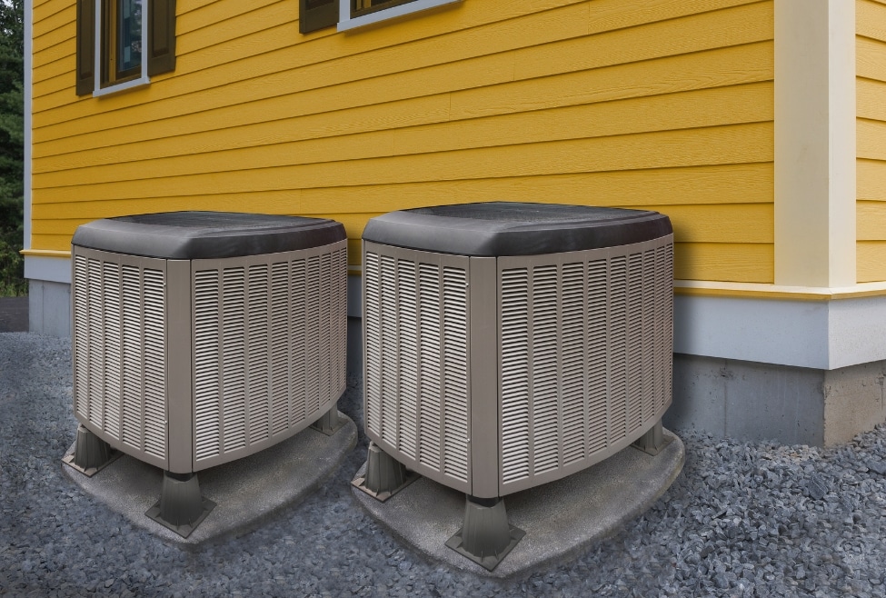 Multiple residential air conditioning units outside a yellow house, showing proper HVAC sizing and installation—relevant for homeowners searching how to size a heating and air conditioning system, air conditioner sizing guide, HVAC installation, or AC replacement by Arctic Air. Trust us to help with how to size a heating and air conditioning system, HVAC sizing calculator, AC unit size for house, heating and cooling load calculation, how many BTUs do I need, what size HVAC system do I need, air conditioner size by square footage, furnace sizing guide, central air sizing near me, HVAC installation near me, air conditioning replacement near me, HVAC repair services near me, residential HVAC sizing, air conditioner installation Acton, HVAC contractor Palmdale, heating and cooling systems Lancaster, HVAC sizing help Rosamond, furnace and AC replacement Tehachapi, best HVAC companies Quartz Hill, HVAC estimate near me, HVAC load calculator, how big of an air conditioner do I need, Arctic Air HVAC services, local HVAC professionals near me, heating and cooling service Littlerock, Pearblossom HVAC technicians, properly sized HVAC systems.