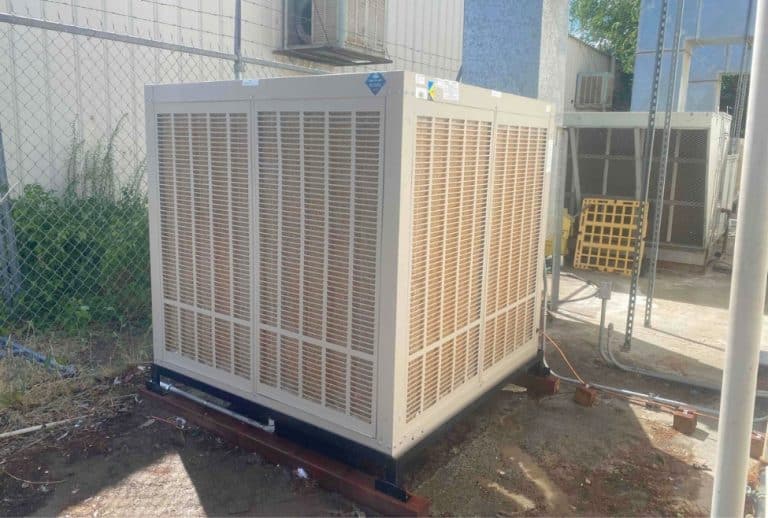 Commercial HVAC system outside of a business building, representing top-rated commercial air conditioner options, energy-efficient HVAC systems, and professional AC installation by Arctic Air. Reach out today for help with best commercial AC unit, top-rated commercial air conditioners, most reliable commercial HVAC brands, commercial air conditioner comparison, energy-efficient commercial AC systems, commercial HVAC installation, commercial HVAC repair, commercial AC replacement, best HVAC system for business, commercial rooftop AC unit, large-scale HVAC systems, best AC for offices, warehouse cooling systems, commercial AC service near me, commercial HVAC contractors near me, commercial AC installation near me, Arctic Air commercial HVAC services, professional HVAC solutions for businesses, reliable AC systems for commercial buildings, industrial HVAC system maintenance.