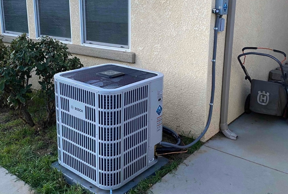 Air conditioner unit outside a home, representing common AC issues like capacitor failure, HVAC capacitor replacement, cost to replace AC capacitor, and professional air conditioning repair services by Arctic Air. Trust us to help you with how much to replace AC capacitor, AC capacitor replacement cost, cost to replace HVAC capacitor, air conditioner capacitor cost, AC capacitor repair near me, HVAC capacitor replacement near me, AC not starting capacitor issue, bad AC capacitor symptoms, air conditioner not cooling repair, AC repair services near me, air conditioning repair near me, HVAC repair near me, central air capacitor replacement, residential AC capacitor cost, emergency AC repair near me, AC maintenance services, affordable AC repair, AC electrical repair, how much does HVAC repair cost, replace AC unit capacitor near me, Arctic Air HVAC services.