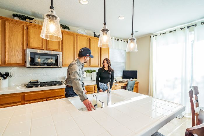 Arctic Air employee speaking with a customer