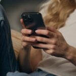 Air Conditioning, Heating & Plumbing Services in Lancaster, CA 5 Person using smartphone while sitting
