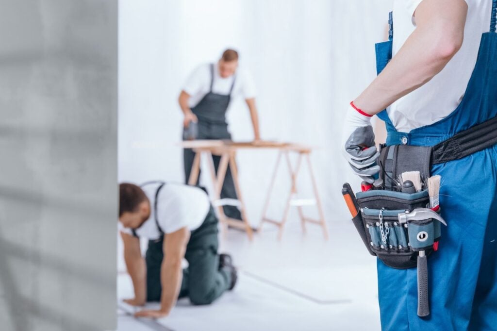Two workers in a construction setting