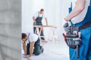 Two workers in a construction setting